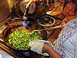 Asian broccoli in the wok getting a little water
