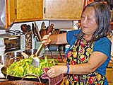 Stir-fying a huge bowl of morning glories