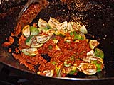 Folding eggplants into chilli paste