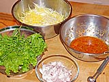 Green mango, dressing, shallots, lettuce, cilantro and mint