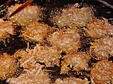 Frying the taro fritters extra crispy