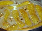 Cooking the bananas in sugar syrup
