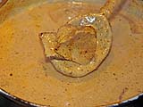 Beef simmering in coconut milk and curry paste