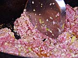 Frying ground beef with garlic and spices