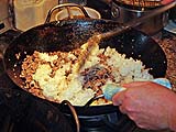 Fold the rice over and press gently to avoid making mush